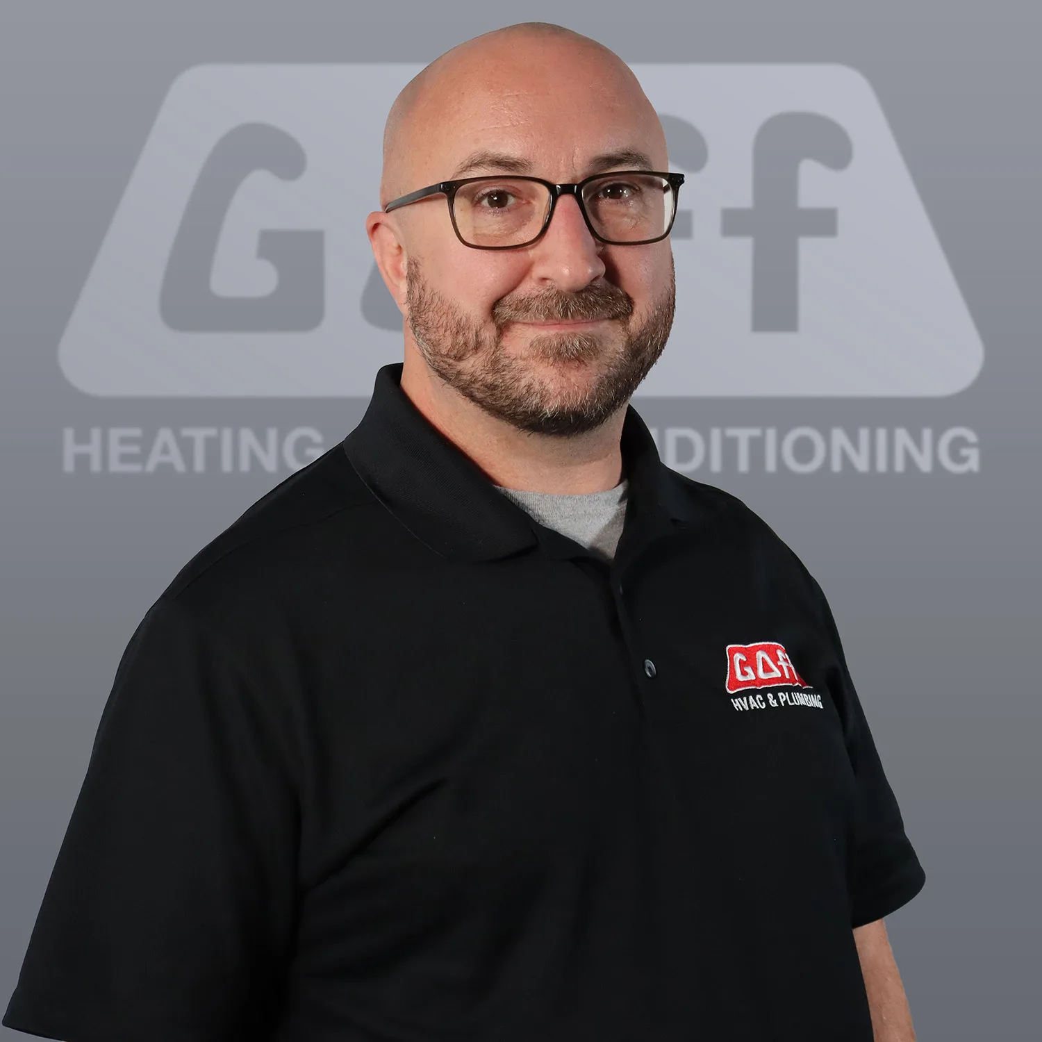 Don G., Service Manager at Goff Heating and Air Conditioning, smiling in a black Goff polo and glasses
