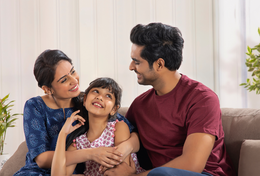 family sitting on a couch indoors