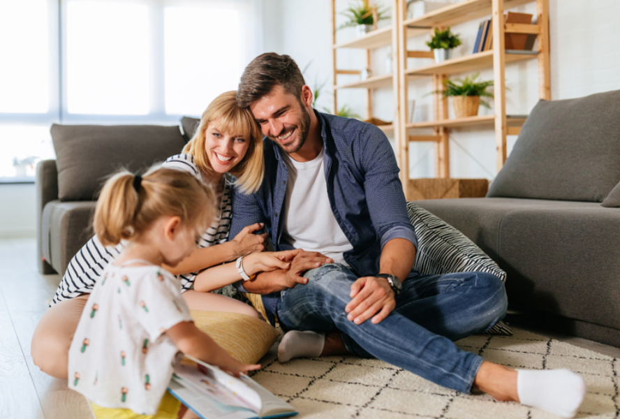 family sitting on a couch indoors