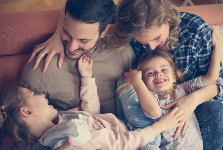 family sitting on a couch indoors